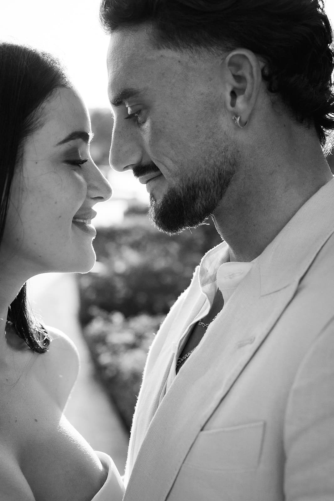 Bride and groom face to face, in black and white